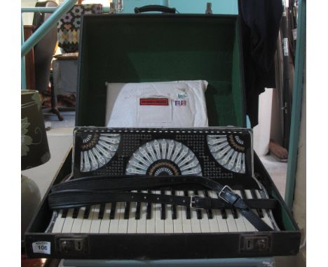 Soprani Italian piano accordion with books in fitted case. (B.P. 24% incl. VAT) 