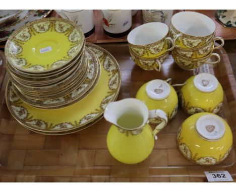 Tray of Royal Worcester porcelain teaware on a yellow ground with foliate and swag decoration.(B.P. 24% incl. VAT) CONDITION 