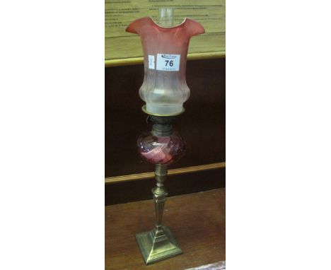 Small brass oil lamp with writhen glass reservoir and brass pedestal base, frosted shade and clear chimney. (B.P. 24% incl. V