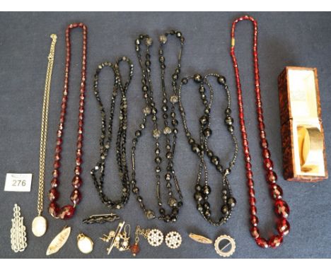 Bag of assorted costume jewellery items to include jet-type beads, gold plated bangle, mother of pearl brooch, etc.(B.P. 24% 