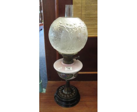 Early 20th Century brass double burner oil lamp with ceramic reservoir and metal base, frosted repousse shade and clear chimn