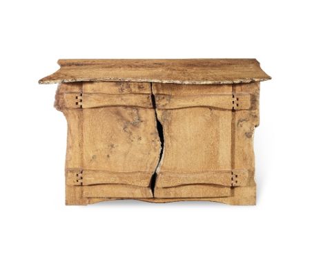 Tim Stead (1952-2000) An ash sideboardThe gnarled rectangular hinged top enclosing an interior above a pair of cupboard doors