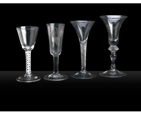 Three wine glasses and an ale glass 18th CenturyComprising a light baluster wine glass, 18.3cm high, an air twist wine glass,