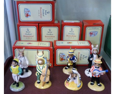 Eight Royal Doulton Bunnykins figures, banjo player, saxophone player, Bunnykins double bass player, clarinet player, jockey 