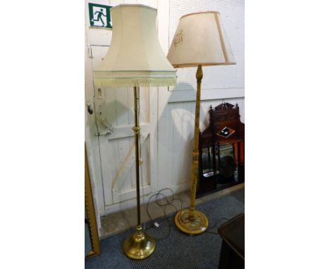 A brass telescopic standard lamp with green fringed shade together with a floral painted standard lamp (2)