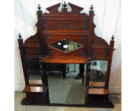 An Edwardian walnut framed four-panel overmantle mirror