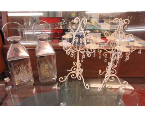 Pair of lanterns together with a pair of decorative candelabra 