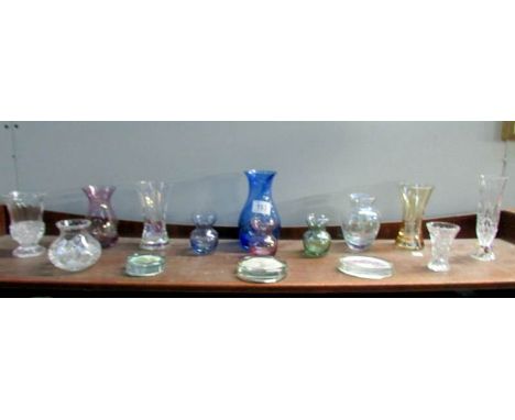 A shelf of assorted glass ware