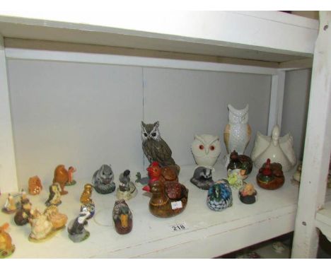 A shelf of assorted animal figures