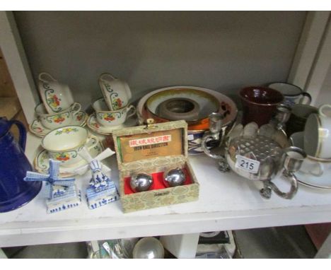 A shelf of miscellaneous china etc