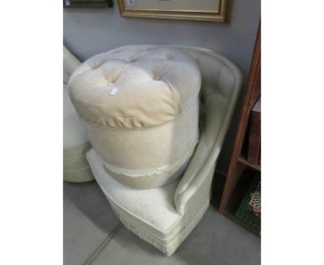 A bedroom chair and a pouffe