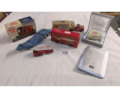 A mixed lot including lighter, cigarette case, die cast models etc