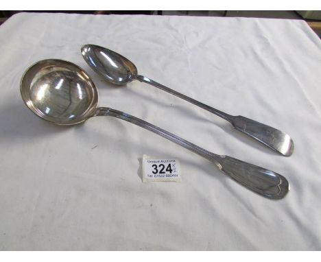 A large silver plated ladle and serving spoon