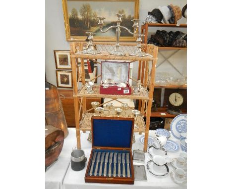 A mixed lot of silver plate and a bamboo shelf unit