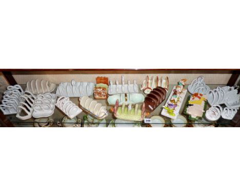 Collection of novelty toast racks including Disney's Seven Dwarves by Wade, and a Carltonware Hovis toast rack (one shelf)