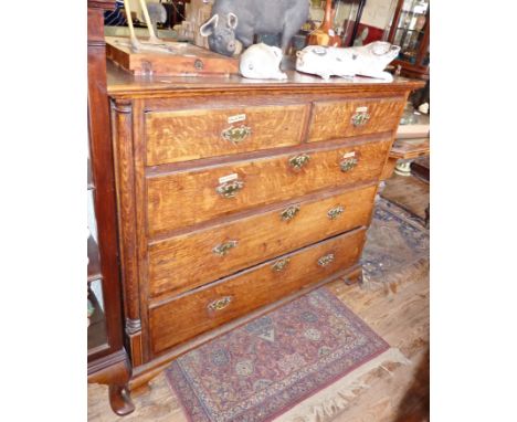 Georgian oak chest of drawers on ogee bracket feet having three dummy drawers and lift-up top above two graduated long drawer