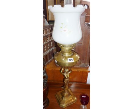 Brass oil lamp with figural base & glass shade, approx 27" high