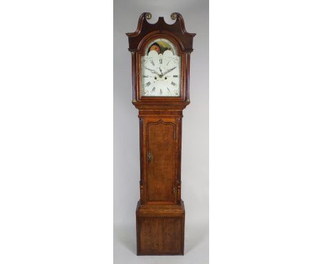 A George III oak and mahogany eight day longcase clock, the 12½ inch painted arched dial signed 'Tho. Lister, Bromley, Halifa