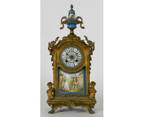 A late 19th century French gilt metal mantel clock with 3 inch porcelain dial with ring of Roman numerals over a serve style 