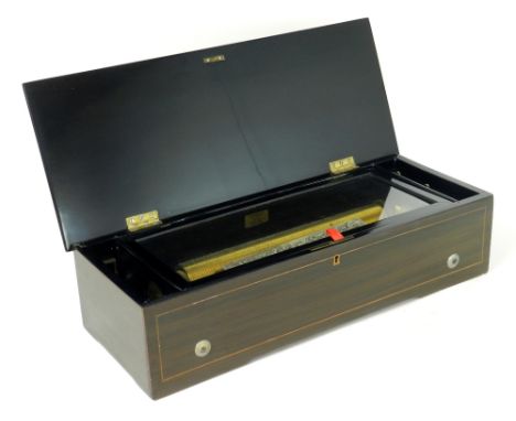 A 19th century Swiss lever wound music box, with 11¾ inch cylinder, single piece comb and zither attachment in a rosewood gra