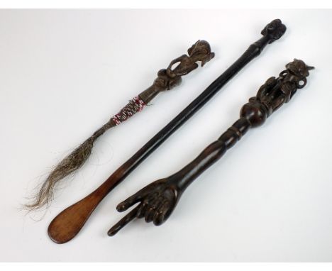 A Chokwe cooking utensil, a bird faced fly swish (possibly Luba tribe), a Chokwe Chief's pointing stick with extended finger,