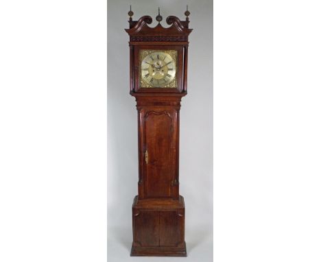 An early 19th century oak crossbanded mahogany longcase clock, with associated 13 inch square brass dial signed 'Coates, Wiga