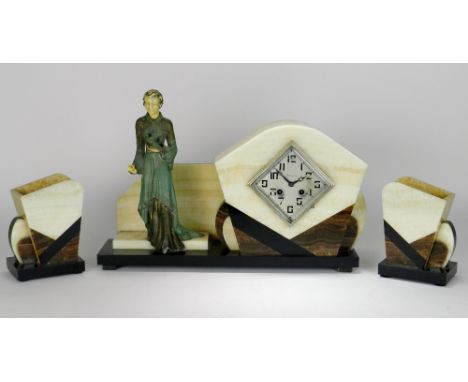 An Art Deco onyx and marble figural clock garniture, the 4 inch square silver dial signed 'I Rouve', within a ring of stylise