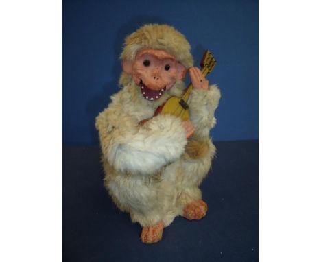 French 19th/20th C Roullet and Decamps clockwork automaton, papier-mache and animal fur monkey (height 28cm) 