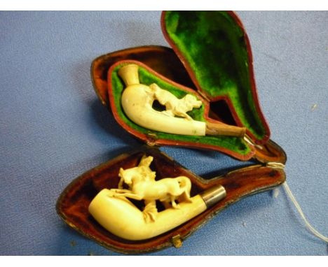 Cased carved bone Meerschaum type pipe with the figure of a dog, and another carved bone pipe with two horses (lacking mouth 