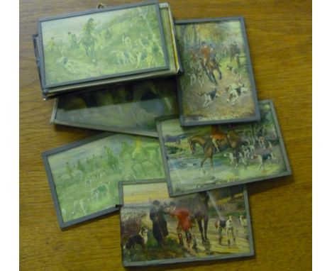 Set of fourteen coloured postcards of fox hunting scenes, mounted behind glass 