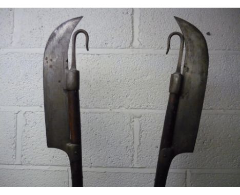 Pair of&nbsp;Lochaber Axes on wooden shafts with butt spikes (overall length 182cm)