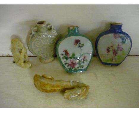 Three Chinese porcelain/ceramic scent/opium bottles, and two carved hard-stone figures one of a monkey, the other (A/F) of a 