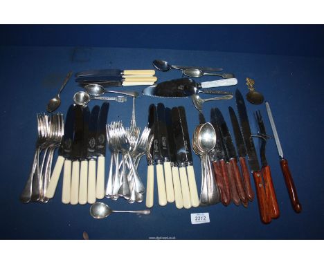 A quantity of cutlery to include; knives, forks, carving set and a Birmingham 1927 silver William Hair Haseler teaspoon.