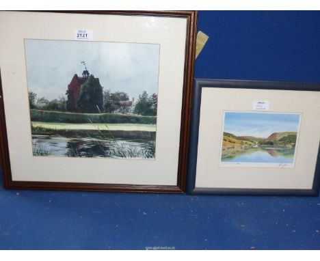 A framed and mounted Watercolour of a house and building with a weather vane and a river running by, indistinctly signed. Tog