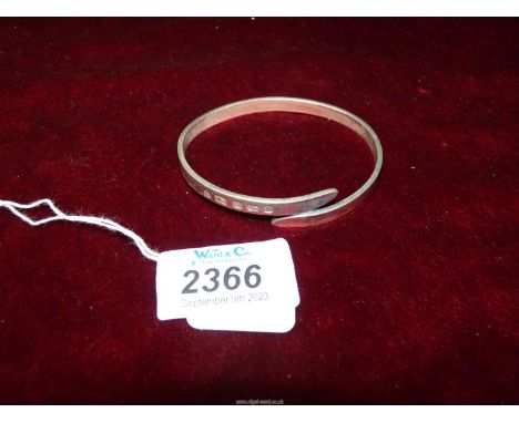 A 925 silver Bangle lightly engraved "Norma" to one end, London hallmark, 25 gms.