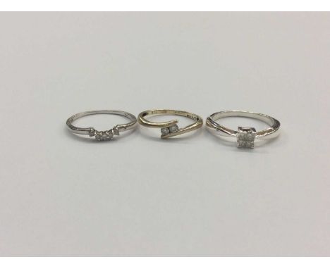 Two 9ct gold diamond set rings and diamond set silver ring (3)Condition report: Two gold rings weigh 2.3g 