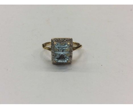 Yellow metal blue topaz and diamond dress ring, size OCondition report: Ring is unmarked and weighs 2.7g 