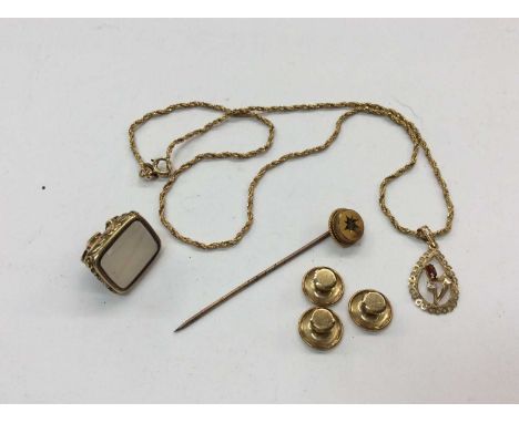 9ct gold pendant on chain, three 9ct gold studs, Victorian 9ct gold stick pin and seal fobCondition report: 9ct pendant, chai