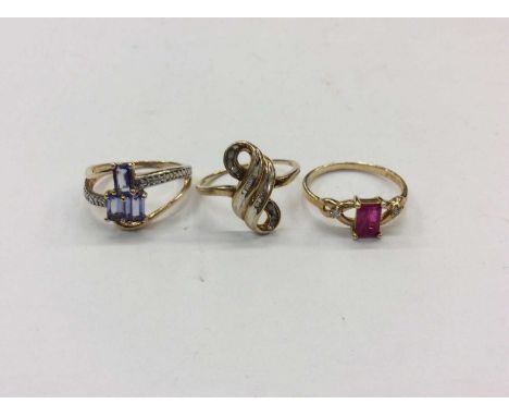 Three 10K gold diamond and gem set dress ringsCondition report: Diamond swirl ring, size N½ and pink stone ring, size N- both