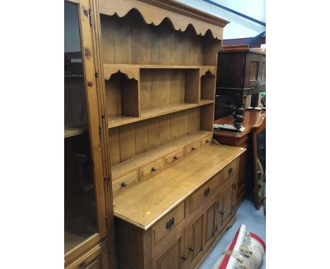Oak two height dresser with shelved back with drawers, three drawers below and three panelled doors on bracket feet 153cm wid