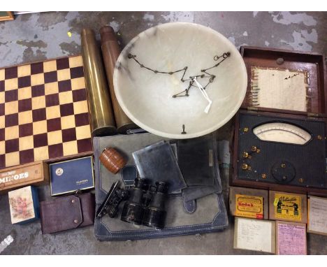 Millivolts gauge in wooden case, pair binoculars, opera glasses, two WWII shell cases, alabaster ceiling light, glass picture
