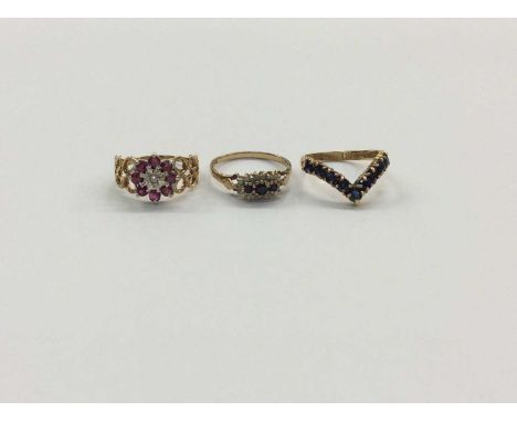 9ct gold ruby cluster ring, size O½, 9ct gold sapphire and diamond cluster ring, size O½ and sapphire wishbone ring, size N (