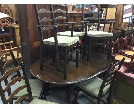 Ercol elm dropleaf dining table and six matching chairs