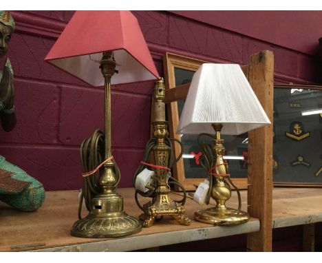 Antique brass table lamp together with another brass table lamp and a giltwood table lamps (3 lamps)