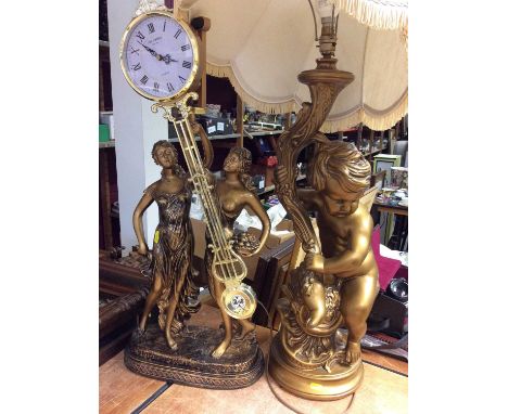 Gilt putto table lamp with shade and a gilt figural clock