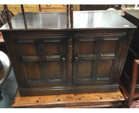 Pair Ercol elm cupboards with panelled doors , each 99 cm wide, 71 cm high