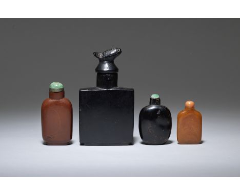 A group of four various snuff bottlesQing Dynasty and laterComprising: a tiny amber flattened baluster bottle with coral stop