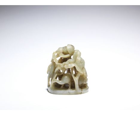 An openwork jade hat finialMing DynastyCarved with egrets amongst lotus, a bird perched on a flowering branch and a terrapin 