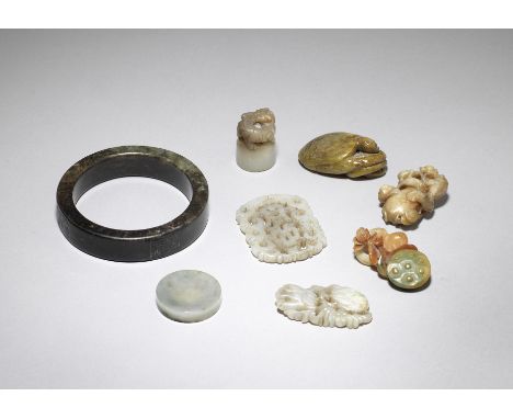 A group of jade, jadeite and hardstone carvings18th century and laterIncluding: a pale green and mushroom jade 'chilong' seal