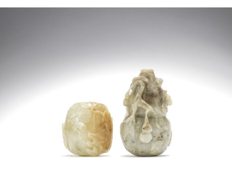 Two jade 'gourd' snuff bottles19th/20th centuryThe first of greyish-white and mushroom tone, carved as a leafy double gourd f